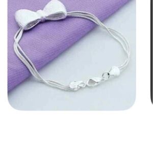 Elegant Silver Bow Bracelet